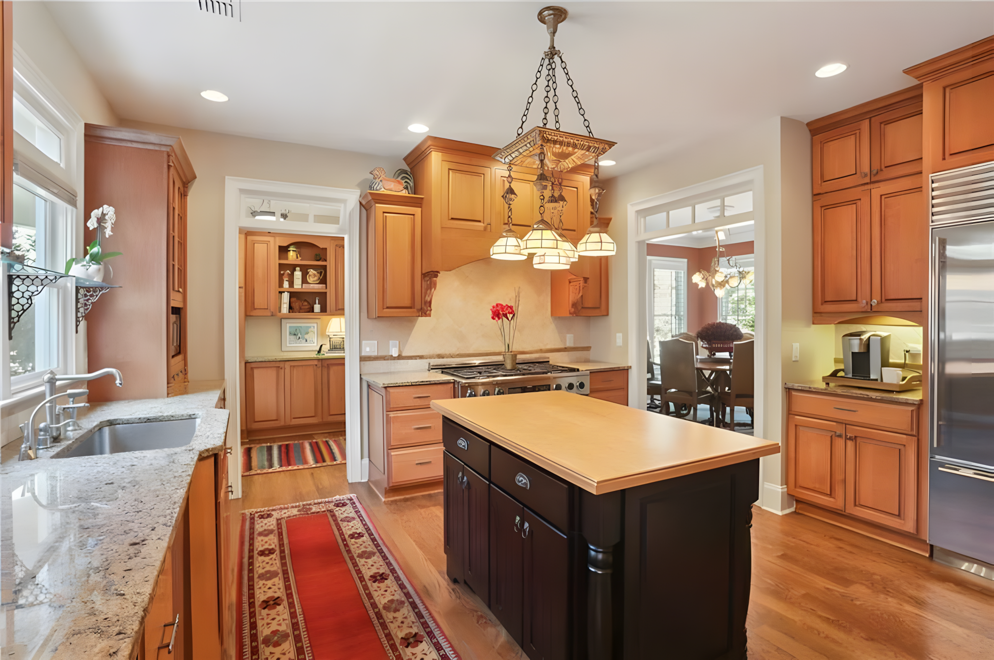 kitchen island with laundry and dining room in view