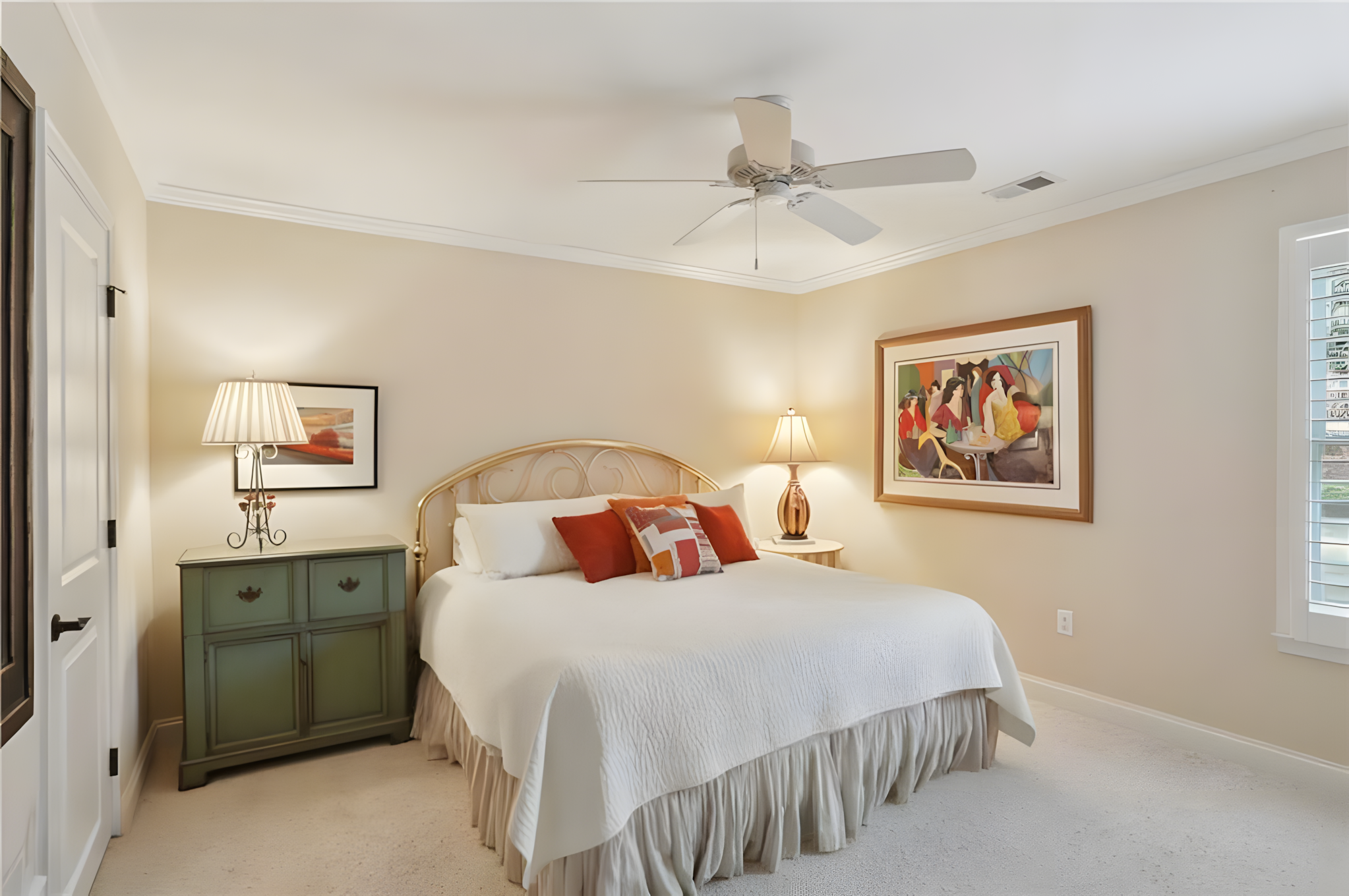 bedroom with green bedside and large art painting on wall