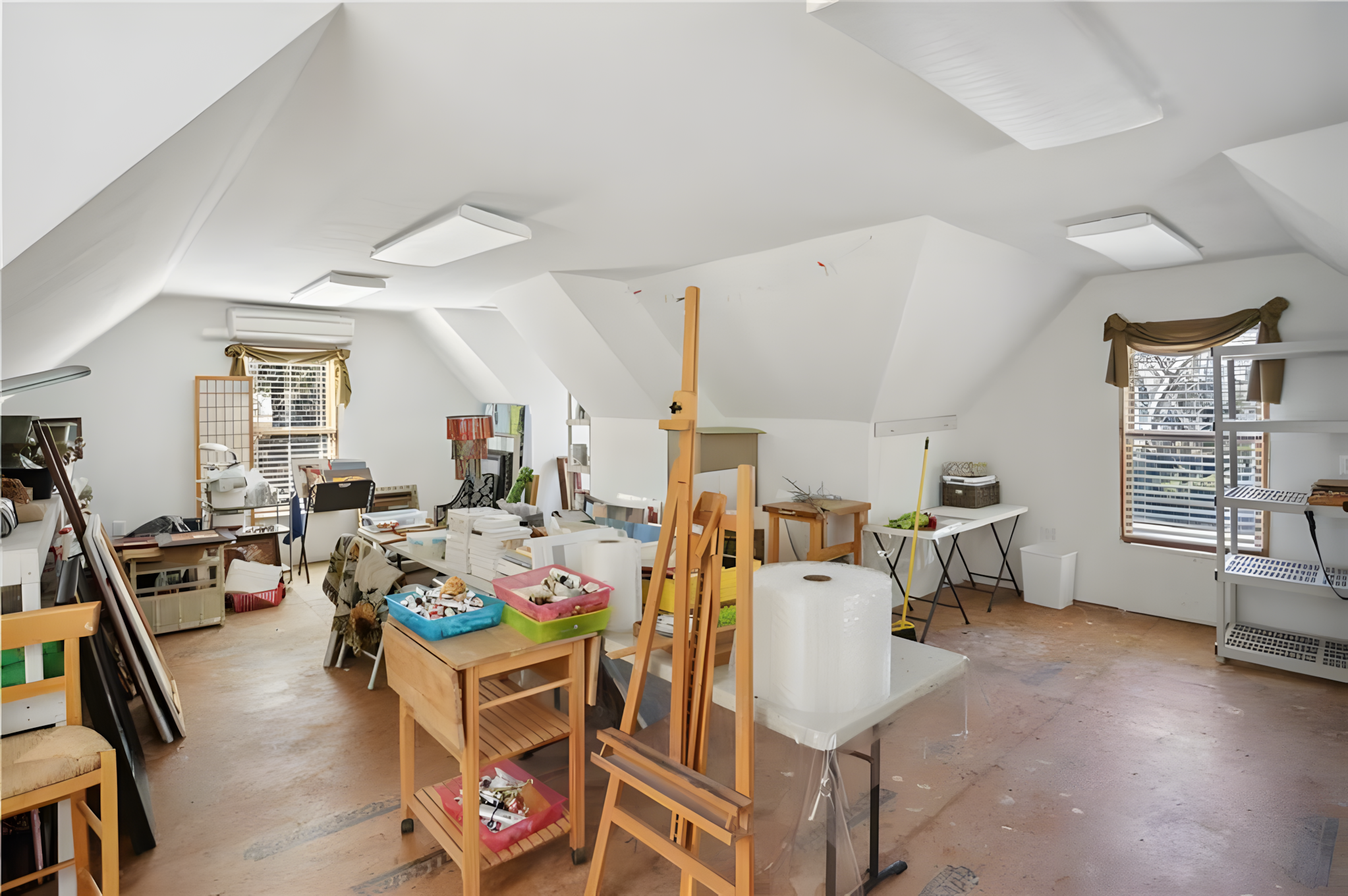 attic with art easel and supply storage