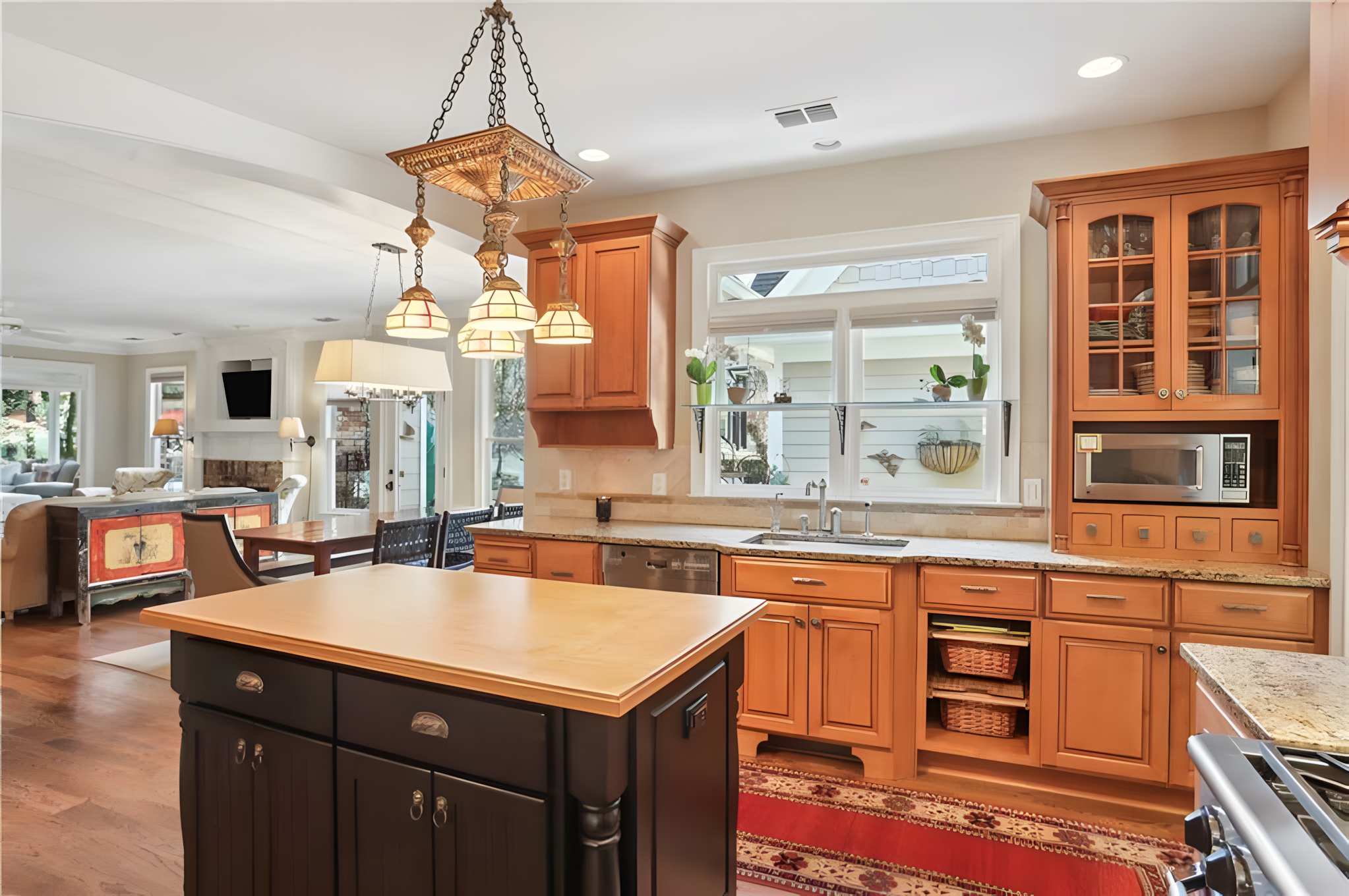 kitchen, natural wood cabinets and hanging light fixture over island