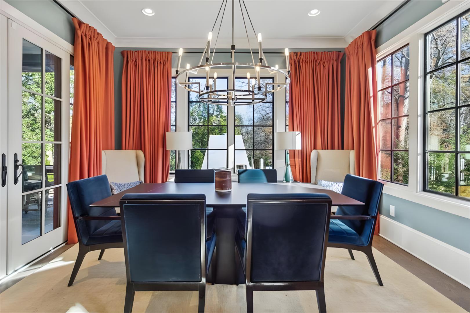dining room orange curtains, velvet dark blue chairs