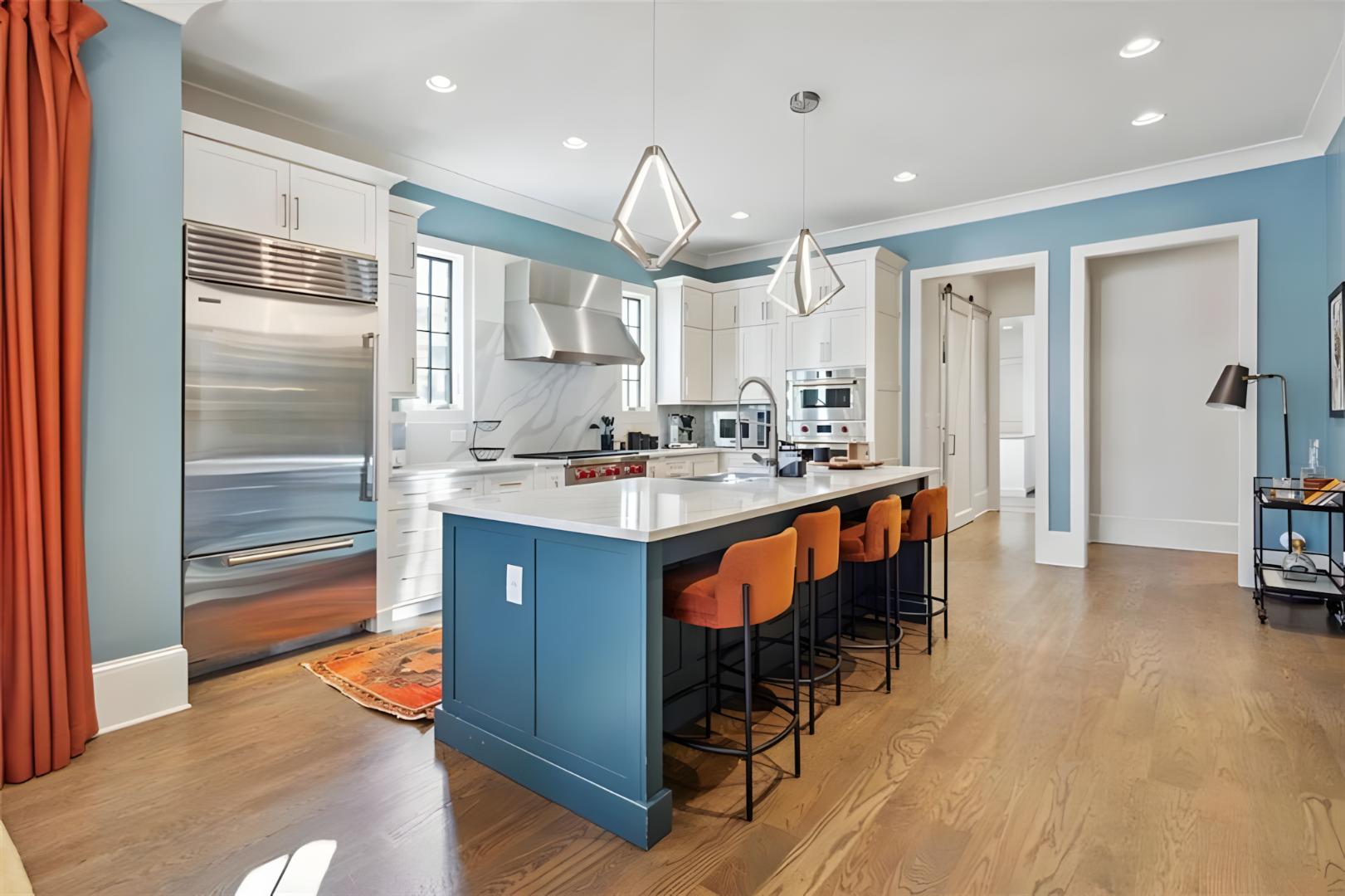 kitchen orange bar stools steel fridge
